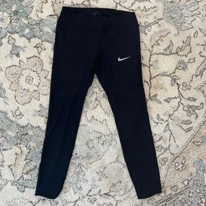 Nike Running Collection Women Ltd Edition Leggings with perforated detailing.